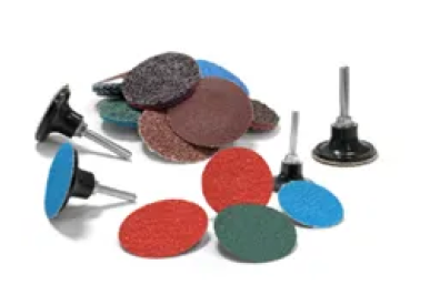 A group of different colored discs and sanding wheels.