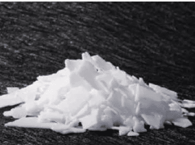 A pile of white substance on top of black surface.