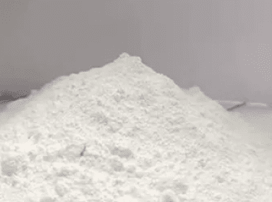 A pile of white powder on top of a gray background.