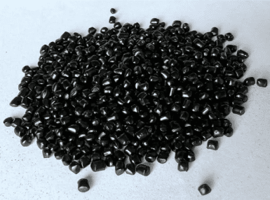 A pile of black plastic pellets on top of each other.