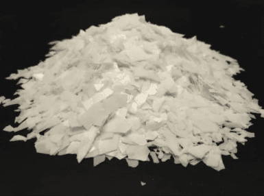A pile of white substance on top of black surface.