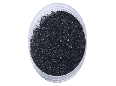 A container of black sand is shown.