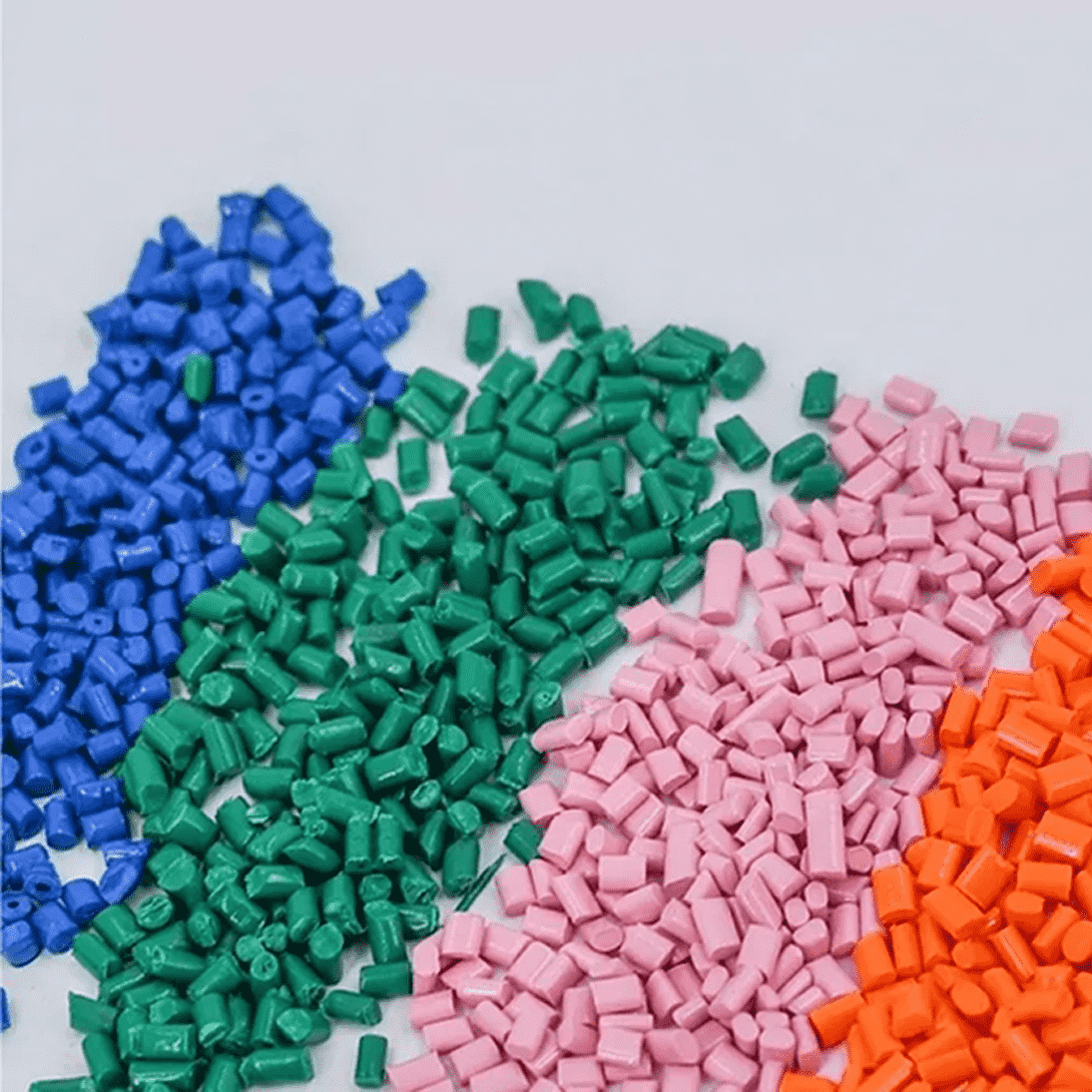 A close up of some different colored plastic granules