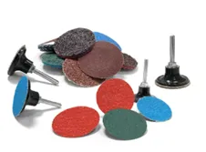 A table with many different types of sanding discs.