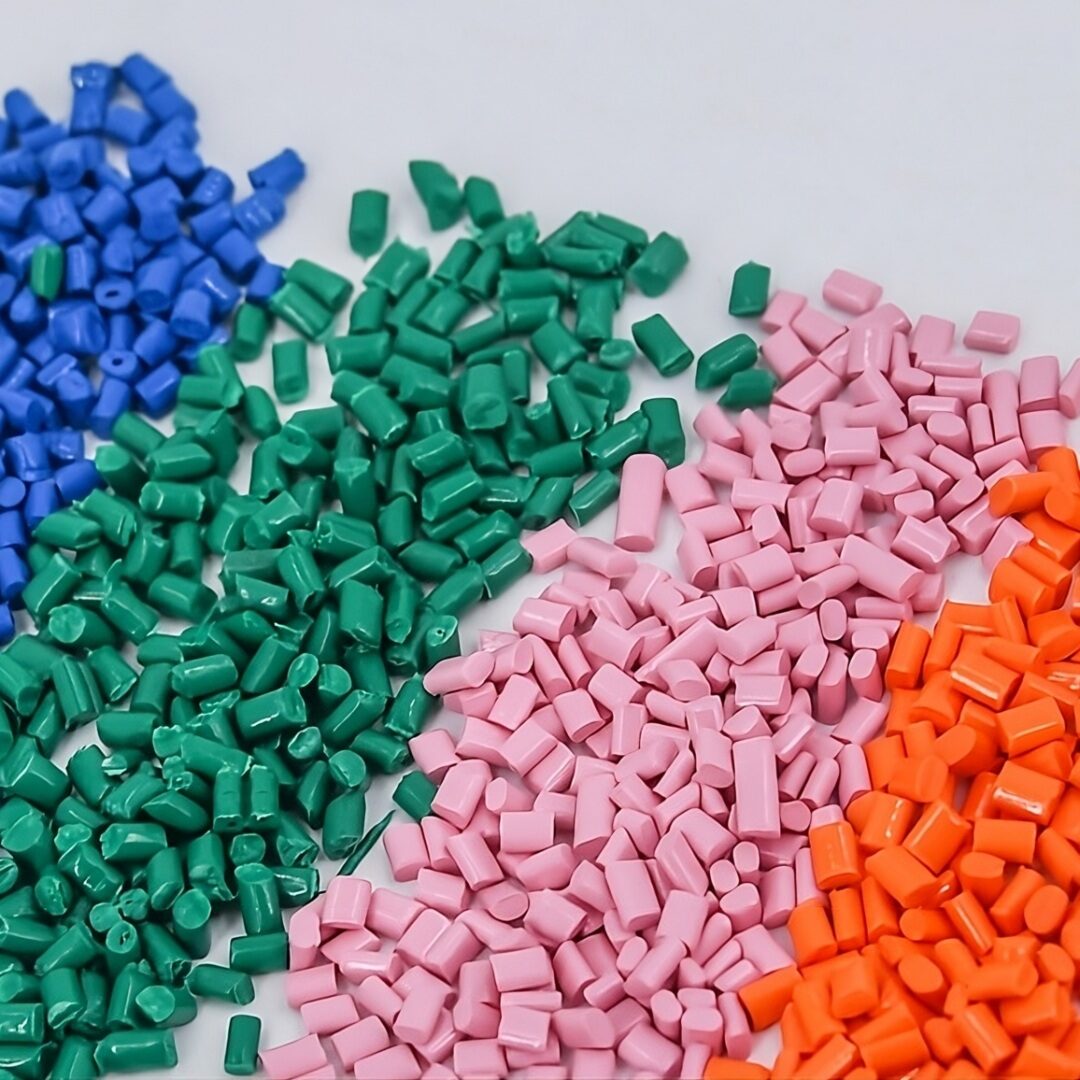 A group of plastic pellets in different colors.